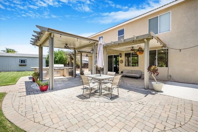 19454 Copper Ridge St, Perris, CA 92570 - view of patio / terrace with a ceiling fan, exterior kitchen, outdoor dining area, and a pergola