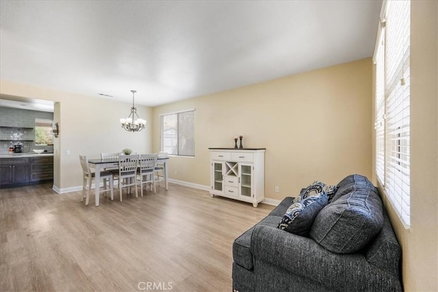 19454 Copper Ridge St, Perris, CA 92570 - living room featuring a chandelier and light wood-style floors