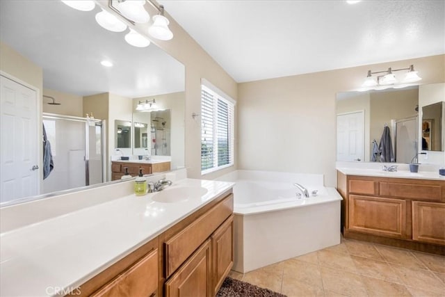 19454 Copper Ridge St, Perris, CA 92570 - full bath with a stall shower, two vanities, a garden tub, tile patterned flooring, and a chandelier