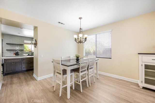19454 Copper Ridge St, Perris, CA 92570 - dining space featuring light wood-style floors and a chandelier