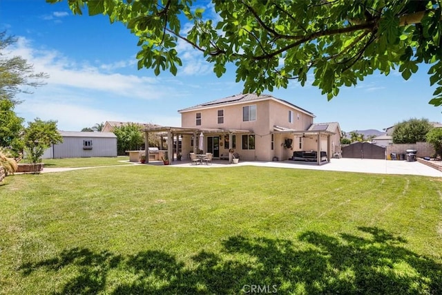 19454 Copper Ridge St, Perris, CA 92570 - back of house featuring a pergola, solar panels, a fenced backyard, a patio area, and stucco siding