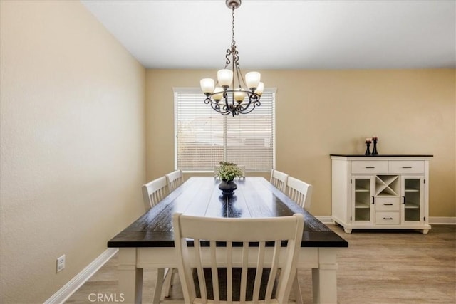 19454 Copper Ridge St, Perris, CA 92570 - dining space with a chandelier and light wood finished floors