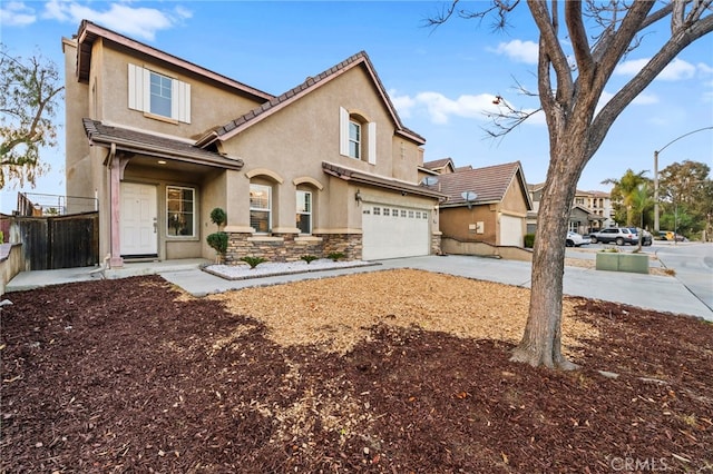 13279 Coffeetree St, Moreno Valley, CA 92553 - view of front of property with stucco siding, concrete driveway, stone siding, and a garage