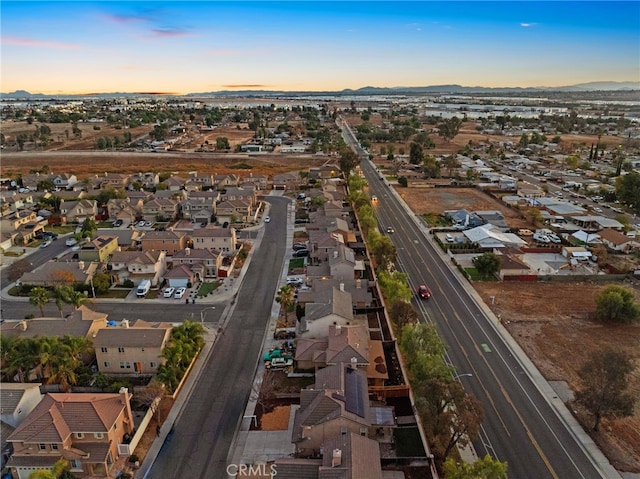 13279 Coffeetree St, Moreno Valley, CA 92553 - aerial view of property and surrounding area featuring nearby suburban area, mountains, and a main thoroughfare