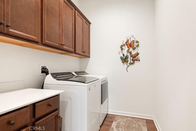 24190 Evesong Dr, Corona, CA 92883 - laundry area with washing machine and dryer, cabinet space, wood finished floors, and baseboards