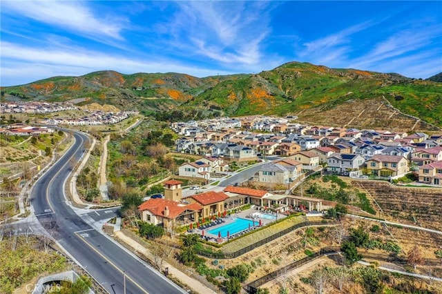 24190 Evesong Dr, Corona, CA 92883 - view of property location featuring a pool area, a mountain backdrop, and nearby suburban area