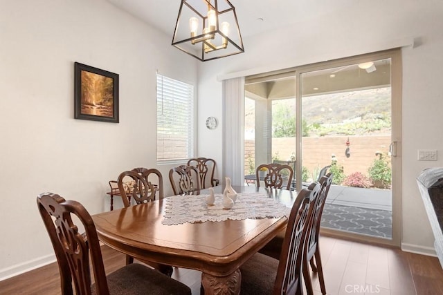 24190 Evesong Dr, Corona, CA 92883 - dining area featuring a chandelier and wood finished floors