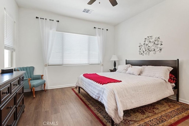 24190 Evesong Dr, Corona, CA 92883 - bedroom with multiple windows, wood finished floors, baseboards, and ceiling fan
