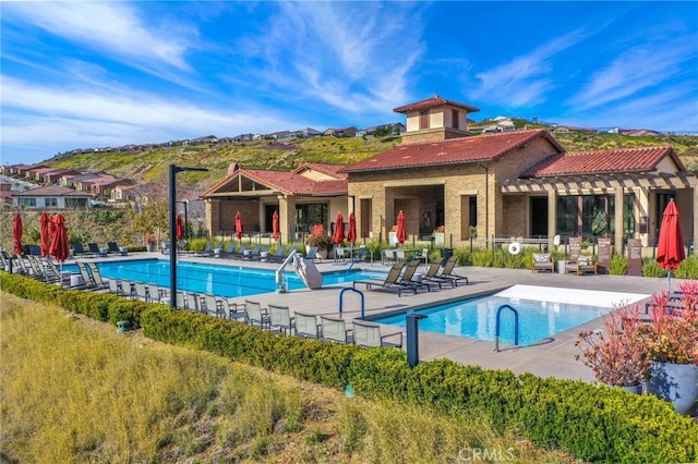 24190 Evesong Dr, Corona, CA 92883 - community pool with a patio and a mountain view