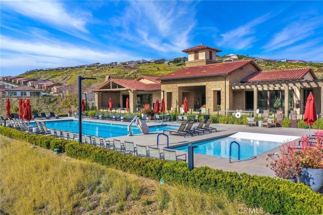 24190 Evesong Dr, Corona, CA 92883 - community pool with a patio area and a mountain view