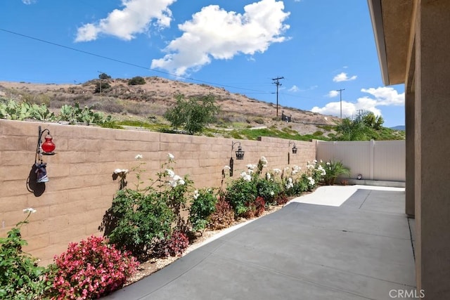 24190 Evesong Dr, Corona, CA 92883 - fenced backyard featuring a patio