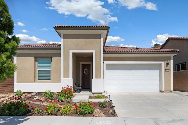 24190 Evesong Dr, Corona, CA 92883 - mediterranean / spanish house with an attached garage, concrete driveway, stucco siding, and a tile roof