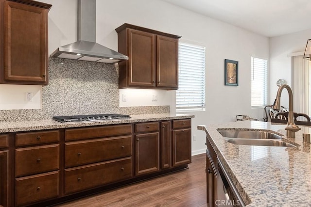 24190 Evesong Dr, Corona, CA 92883 - kitchen with wall chimney exhaust hood, a sink, appliances with stainless steel finishes, dark wood-type flooring, and tasteful backsplash