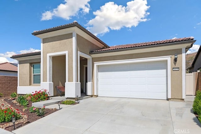 24190 Evesong Dr, Corona, CA 92883 - mediterranean / spanish-style house featuring driveway, stucco siding, an attached garage, and a tiled roof
