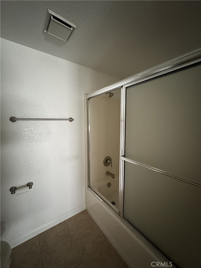 3178 Dogwood Dr, Corona, CA 92882 - bathroom with bath / shower combo with glass door, tile patterned floors, and baseboards
