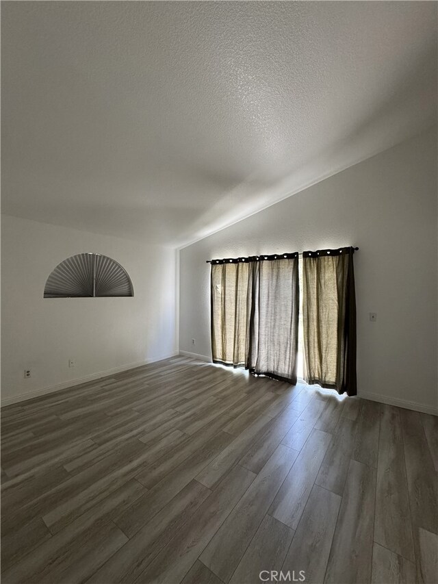 3178 Dogwood Dr, Corona, CA 92882 - unfurnished room with wood finished floors and a textured ceiling