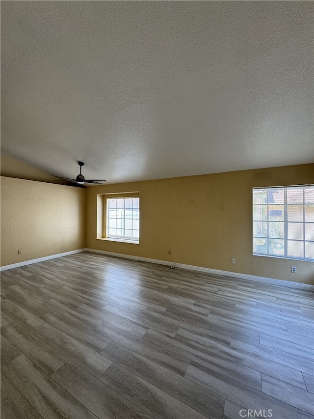 3178 Dogwood Dr, Corona, CA 92882 - empty room featuring a textured ceiling, wood finished floors, ceiling fan, and baseboards