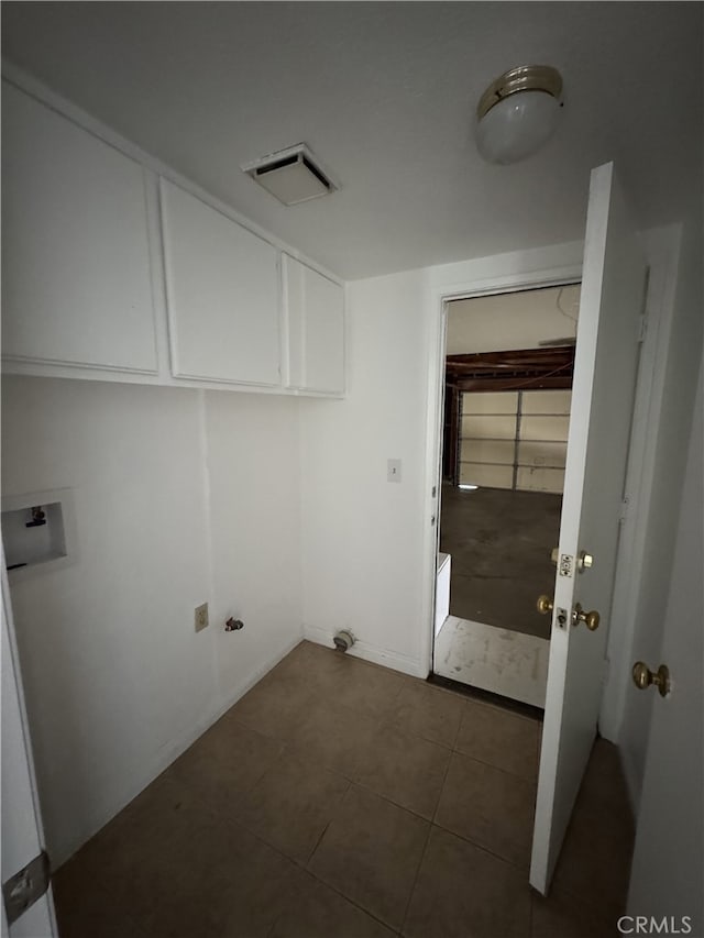3178 Dogwood Dr, Corona, CA 92882 - washroom featuring hookup for a washing machine, cabinet space, dark tile patterned flooring, and baseboards