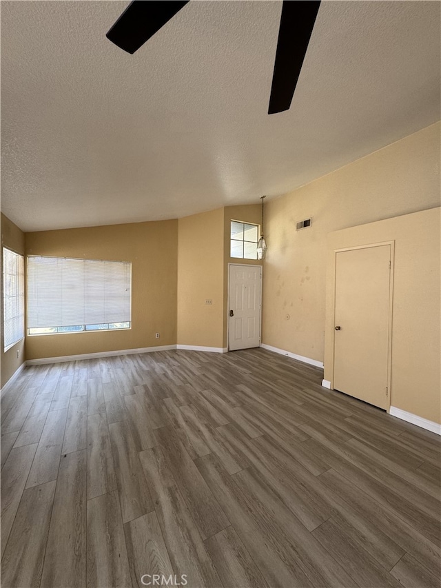 3178 Dogwood Dr, Corona, CA 92882 - empty room with healthy amount of natural light, wood finished floors, a textured ceiling, and baseboards