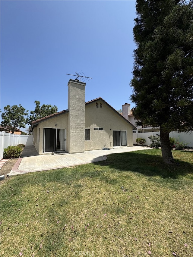 3178 Dogwood Dr, Corona, CA 92882 - rear view of property featuring a patio area, a chimney, and stucco siding