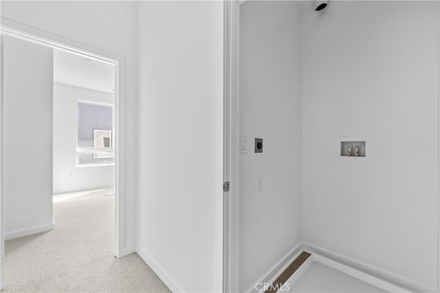 94231/2 N Sepulveda Blvd Unit 4, North Hills, CA 91343 - washroom featuring hookup for a washing machine, hookup for an electric dryer, baseboards, and light colored carpet