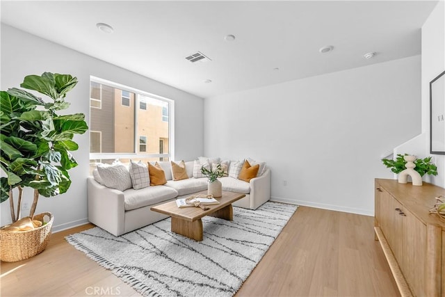 94231/2 N Sepulveda Blvd Unit 4, North Hills, CA 91343 - living room featuring light wood finished floors and baseboards