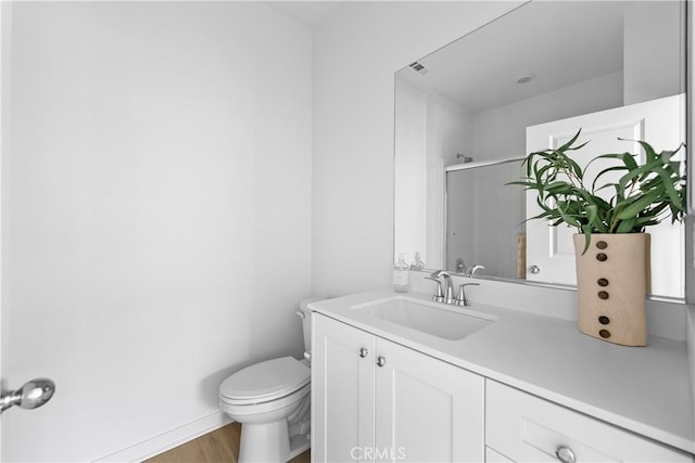 94231/2 N Sepulveda Blvd Unit 4, North Hills, CA 91343 - bathroom with toilet, vanity, a shower with door, wood finished floors, and baseboards