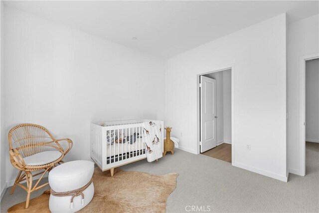 94231/2 N Sepulveda Blvd Unit 4, North Hills, CA 91343 - carpeted bedroom featuring baseboards