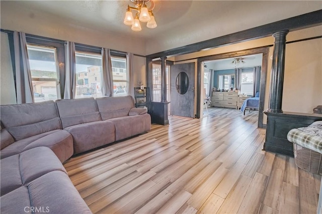5837 Esperanza Ave, Whittier, CA 90606 - living room featuring light wood-type flooring and decorative columns