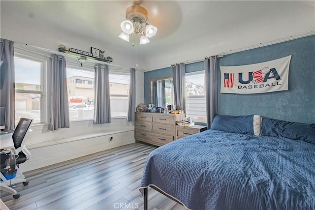 5837 Esperanza Ave, Whittier, CA 90606 - bedroom featuring wood finished floors, multiple windows, and a ceiling fan