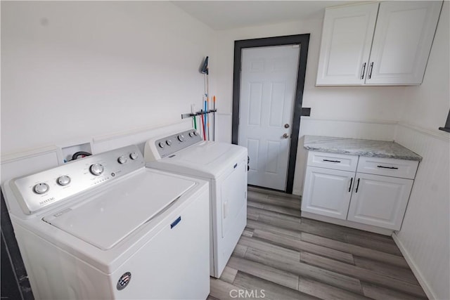 5837 Esperanza Ave, Whittier, CA 90606 - laundry area featuring washer and clothes dryer, cabinet space, and light wood-style floors