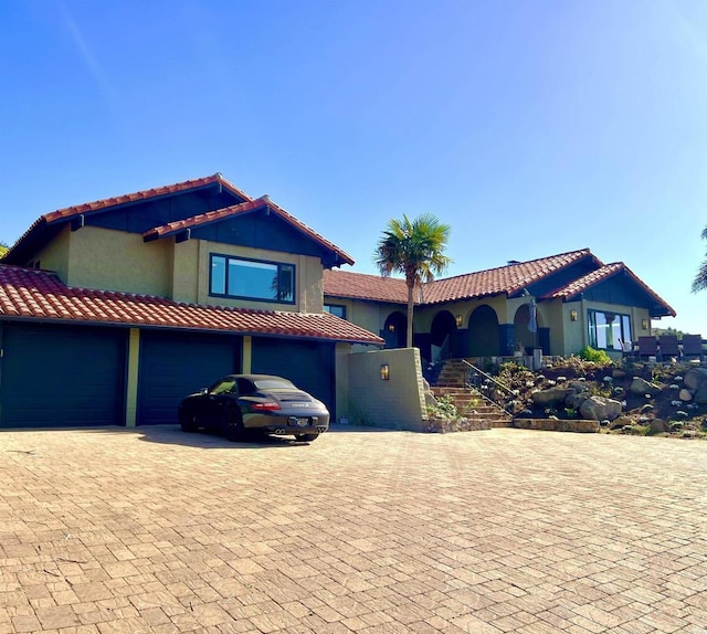 2073 Elevado Rd, Vista, CA 92084 - mediterranean / spanish house with decorative driveway, a tiled roof, and stucco siding