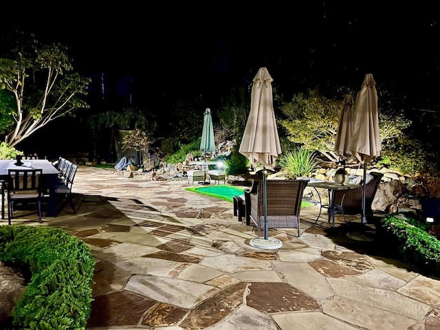 2073 Elevado Rd, Vista, CA 92084 - patio at night featuring outdoor dining space and a patio