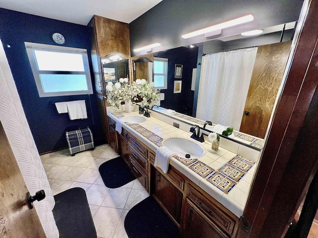 2073 Elevado Rd, Vista, CA 92084 - full bath with double vanity, tile patterned floors, and a shower with shower curtain