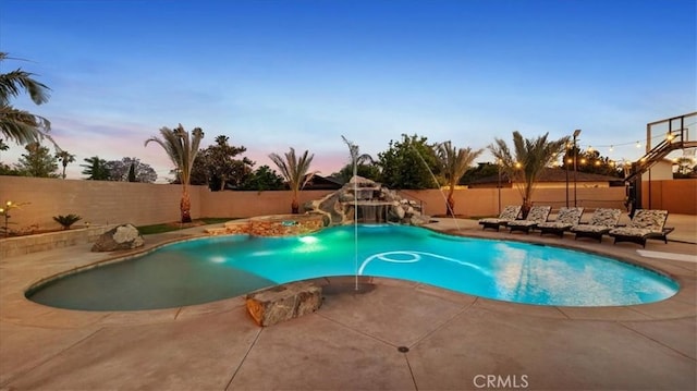 17623 Pine Ave, Fontana, CA 92335 - pool at dusk with a water slide, a fenced backyard, a patio, and an outdoor hot tub