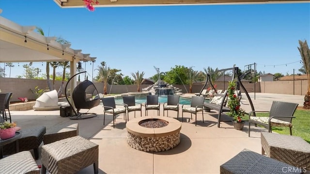 17623 Pine Ave, Fontana, CA 92335 - fenced backyard featuring an outdoor fire pit and a patio