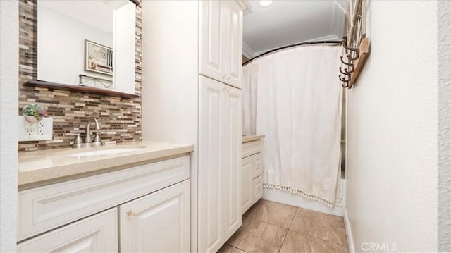 17623 Pine Ave, Fontana, CA 92335 - bathroom featuring vanity, tasteful backsplash, tile patterned flooring, and shower / tub combo