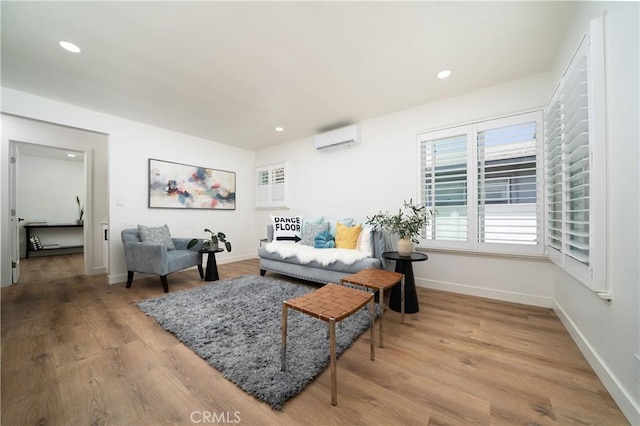 3037 Pacific Ave, Long Beach, CA 90806 - living room with a wall mounted AC, wood finished floors, baseboards, and recessed lighting