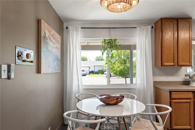 1516 Downing Ave, Chico, CA 95926 - dining space featuring a chandelier and baseboards