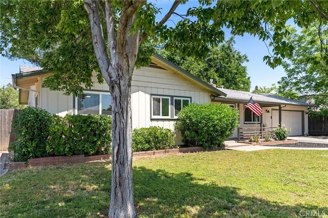 1516 Downing Ave, Chico, CA 95926 - view of front facade with an attached garage, concrete driveway, and board and batten siding