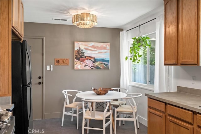 1516 Downing Ave, Chico, CA 95926 - dining room with a chandelier and baseboards