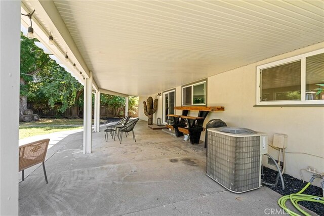 1516 Downing Ave, Chico, CA 95926 - fenced backyard featuring a patio area and cooling unit