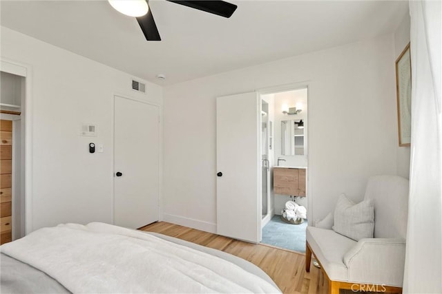 1516 Downing Ave, Chico, CA 95926 - bedroom with light wood-style floors, ensuite bathroom, baseboards, and ceiling fan