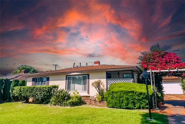 10249 Deveron Dr, Whittier, CA 90601 - single story home with stucco siding, a front yard, a chimney, and a garage