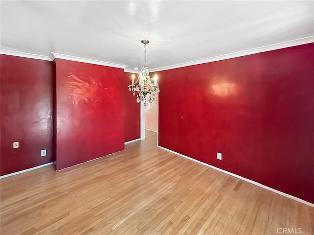 10249 Deveron Dr, Whittier, CA 90601 - unfurnished room featuring hardwood / wood-style flooring, a chandelier, and ornamental molding