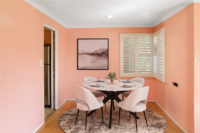 10249 Deveron Dr, Whittier, CA 90601 - dining room with light wood-style floors and ornamental molding