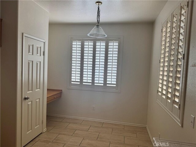 14543 Handsdale St, Adelanto, CA 92301 - unfurnished dining area with baseboards