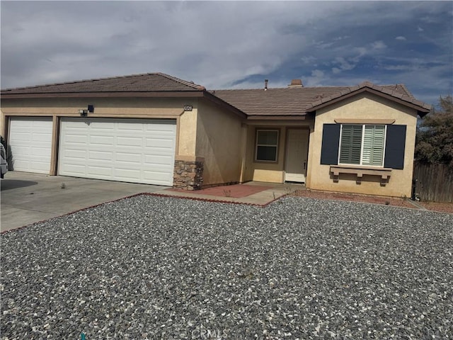 14543 Handsdale St, Adelanto, CA 92301 - single story home featuring stucco siding, driveway, a garage, and a tile roof