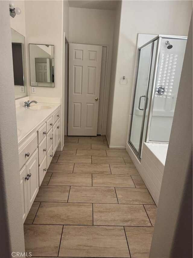 14543 Handsdale St, Adelanto, CA 92301 - bathroom featuring wood tiled floors, a stall shower, vanity, and a bath