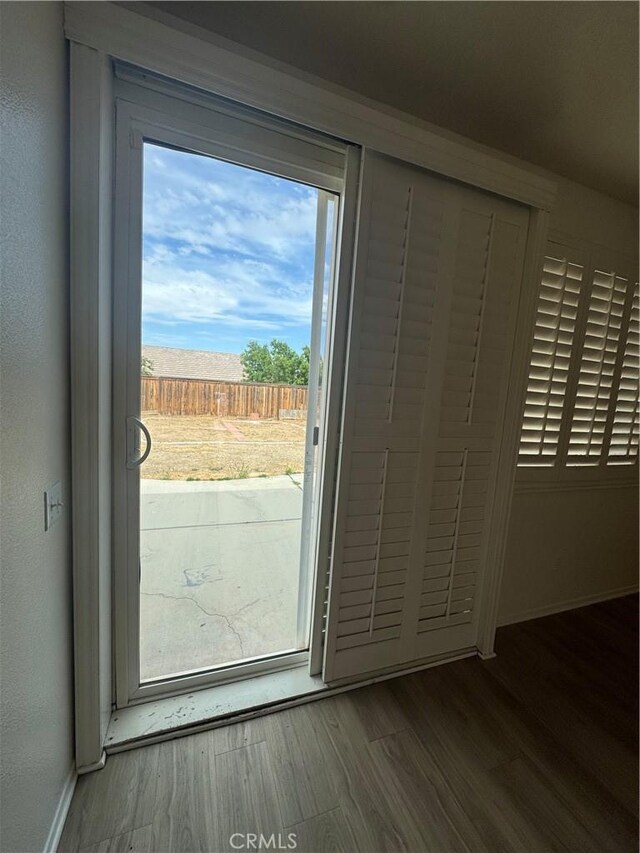 14543 Handsdale St, Adelanto, CA 92301 - doorway to outside with wood finished floors and baseboards
